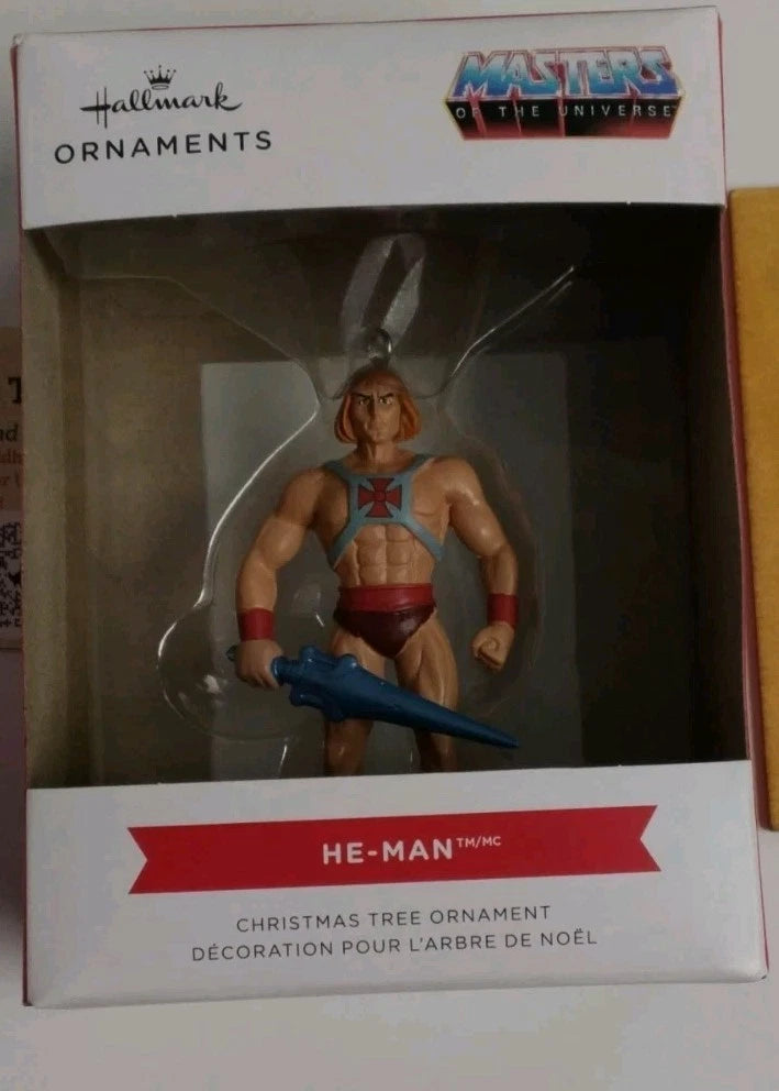 He-Man Christmas tree ornament in packaging with Hallmark and Masters of the Universe branding.